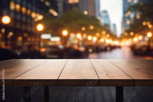 Wooden cafe table bokeh background, empty wood desk restaurant tabletop counter in bar or coffee shop surface product display mockup with blurry city lights backdrop presentation. Mock up, copy space.