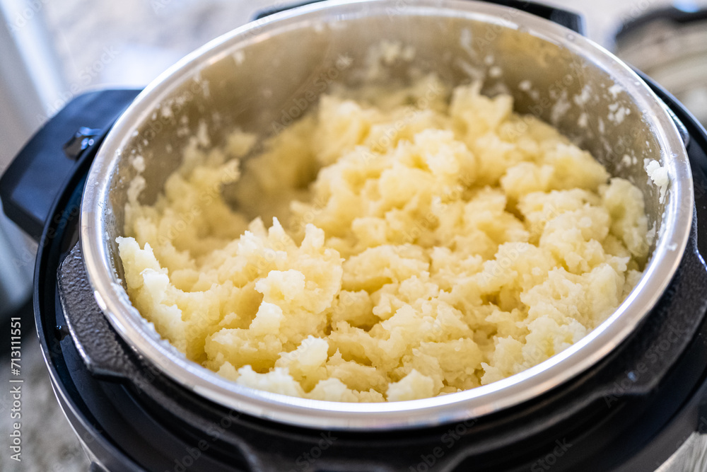 Whipping Up Creamy Mashed Potatoes in Modern Kitchen Whipping Up Creamy Mashed Potatoes in Modern Kitchen