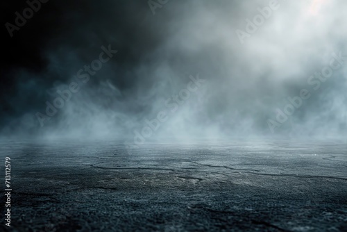 An image of an empty concrete floor with smoke rising from it. This versatile picture can be used to depict mystery, danger, or an industrial setting
