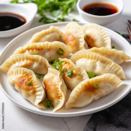Fried Chinese dumplings, hot sauce, shelves for food, national dishes of China, unusual serving, rustic. Chinese cuisine.