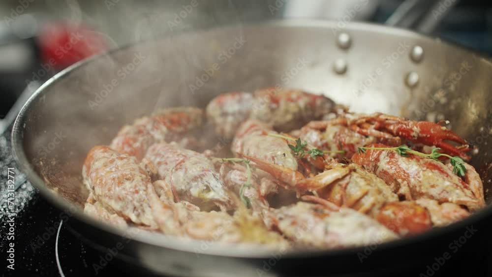 Seafood, the process of roasting crayfish seasoned with herbs, fired in a frying pan, restaurant, 4k super slow motion.