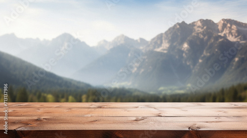 Wooden table mountains bokeh background, empty wood desk surface product display mockup with blurry nature hills landscape abstract travel backdrop advertising presentation. Mock up, copy space.