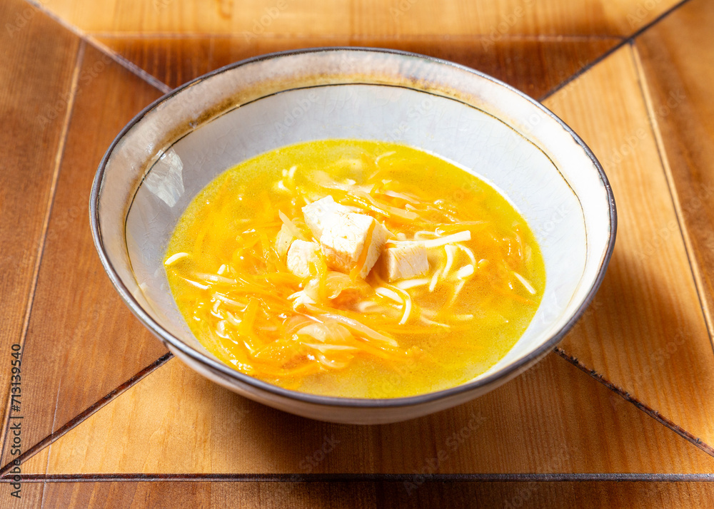 Chicken noodle soup. On a wooden table. Chicken noodle soup. On a wooden table.