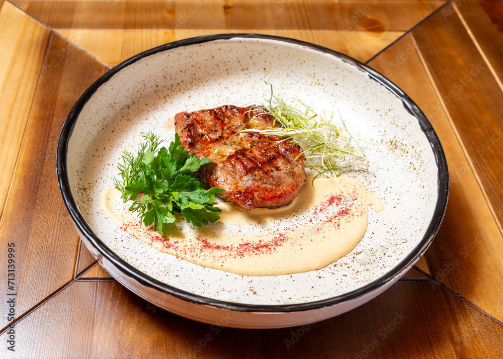 Grilled beef steak. On a wooden table. Grilled beef steak. On a wooden table.