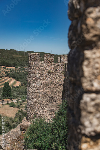 Penela Castle, in Coimbra Portugal, with its walls on a sunny summer day. photo