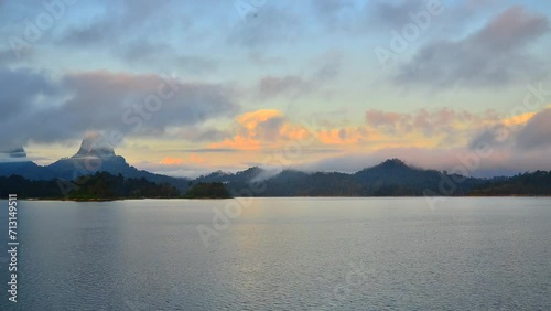 Time lapse of sunrise at Khao Sok National Park, Surat Thani, Landscape Mountains for travelers, Cheow Lan lake, Ratchaphapha dam, Travel nature in Thailand, Asia summer  vacation travel trip. 