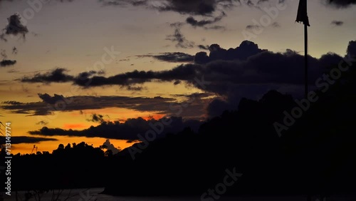 Time lapse of sunset at Khao Sok National Park, Surat Thani, Landscape Mountains for travelers, Cheow Lan lake, Ratchaphapha dam, Travel nature in Thailand, Asia summer  vacation travel trip. 