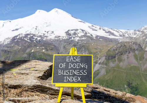 Ease of doing business index symbol. Concept words Ease of doing business index on beautiful blackboard. Beautiful mountain Elbrus background. Business ease of doing business index concept. Copy space © Dzmitry