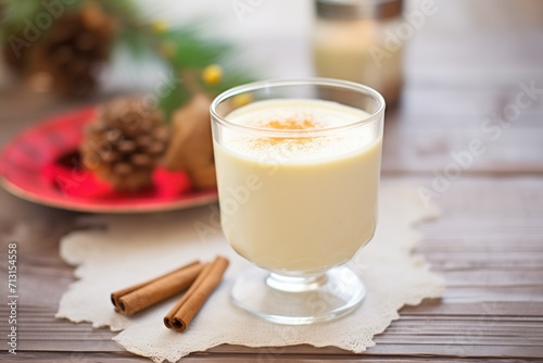 eggnog in a vintage glass, focus on froth