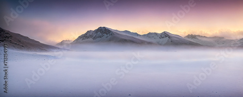 sunset over the snow mountains