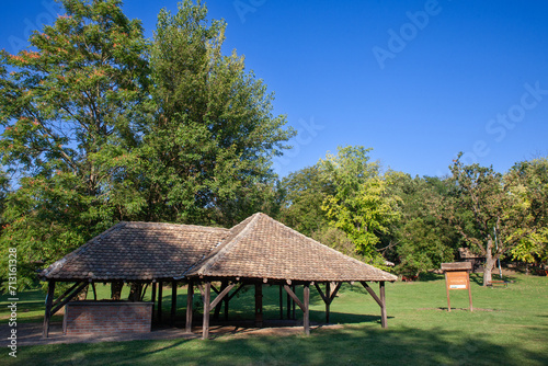 Panorama of the main clearing of Devojacki bunar with its iconic Wooden well in summer. Devojacki Bunar is a touristic settlement of Vojvodina, in Serbia.