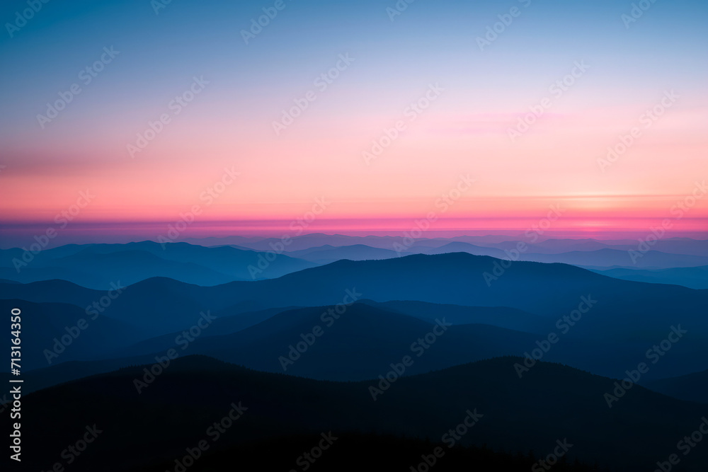 Sunset Radiance Over Mountainous Silhouettes