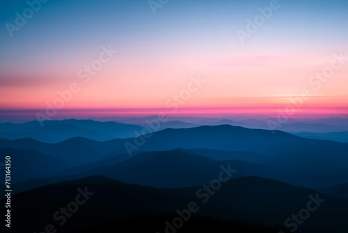Sunset Radiance Over Mountainous Silhouettes