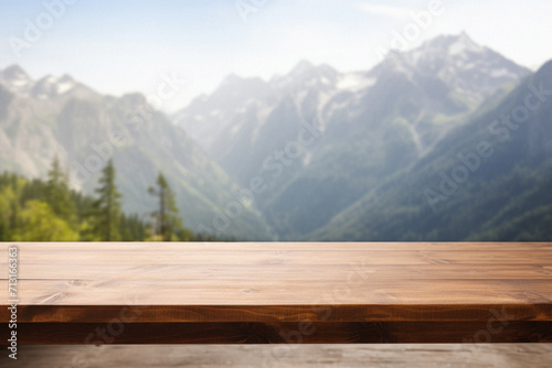 Wooden table mountains bokeh background  empty wood desk surface product display mockup with blurry nature hills landscape abstract travel backdrop advertising presentation. Mock up  copy space.