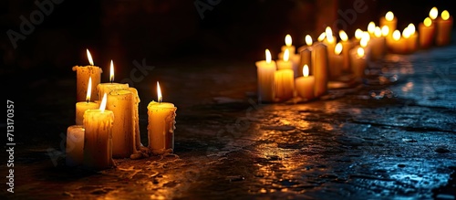 Religious and devoutness scene candles burning in the dark. Copy space image. Place for adding text photo