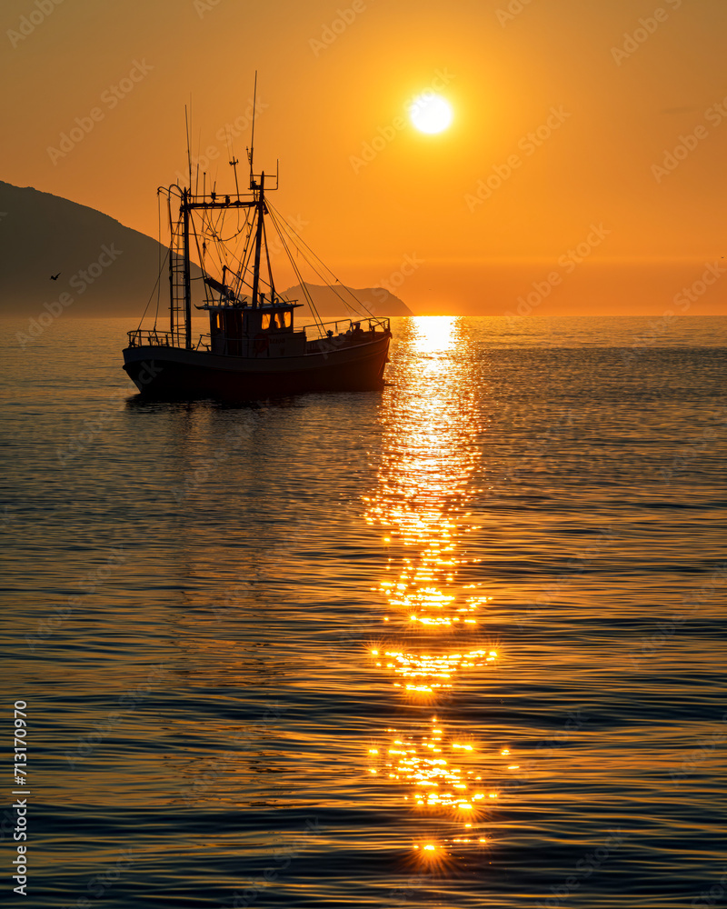 Golden Sunrise Over Solitary Boat