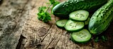 Heap of fresh sliced Cucumbers on an old wooden table. Copy space image. Place for adding text