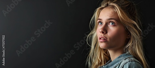 Blonde woman is feeling lazy she is trying to find something interesting on tv to pay her attention but there is nothing interesting I m so bored. Copy space image. Place for adding text