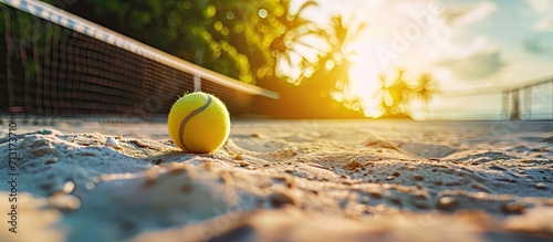 Beach tennis ball and racket on the court. Copy space image. Place for adding text photo