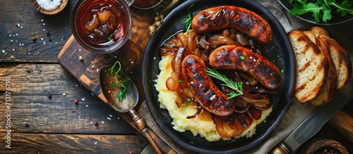 Sausages with fried onions and mashed potatoes. Copy space image. Place for adding text