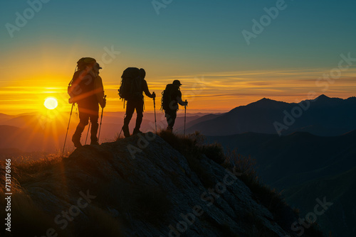 Hiking Team on Mountain Path at Sunset
