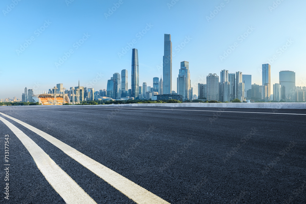 Empty asphalt and city buildings skyline Empty asphalt and city buildings skyline