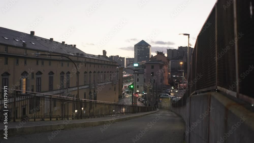 View of piazza del Principe, Genoa, Italy in the evening with traffic and buildings with the Matitone building View of piazza del Principe, Genoa, Italy in the evening with traffic and buildings with the Matitone building