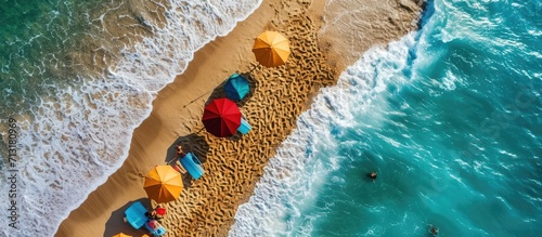 Tropical beach with colorful umbrellas Picture with drone. Copy space image. Place for adding text photo