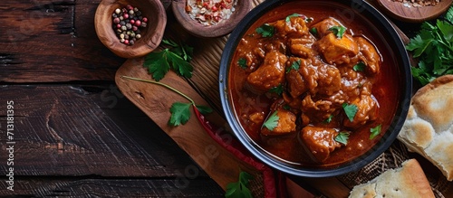 Spicy red chicken curry Kerala style chicken vindaloo Butter chicken Murgh Makhani curry roast hot and spicy gravy dish Dhaba Punjab India North Indian non vegetarian cuisine Garam Masala tikka photo