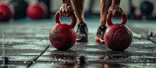 Bodybuilder man clapping hands and preparing for workout at a gym Workout with red kettlebells. Copy space image. Place for adding text photo