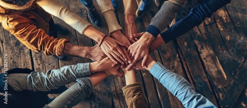 Multiethnic Ethnic Business people Putting Hand Volunteer Friendship Together Friends with stack of hands showing unity and trust worthy Partnership Teamwork team Collaborate working with compe