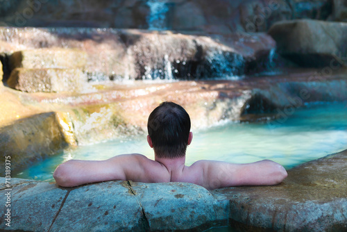 Men relaxing in pool at termal resort photo