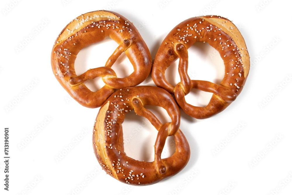 Three Bavarian Pretzel with Salt on White Background Top View Three Bavarian Pretzel with Salt on White Background Top View