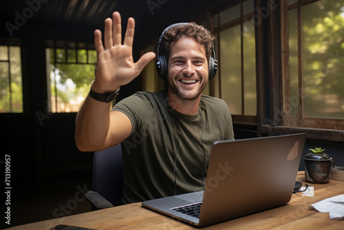 Joyful man celebrating success, reading good news by email, happy and overjoyed businessman sitting at his desk