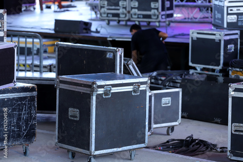 Technician working. Drawers for carrying equipment for shows and setting up stages. Trunks for technical equipment for events. Technical setup of stage for show with lights and sounds. 
