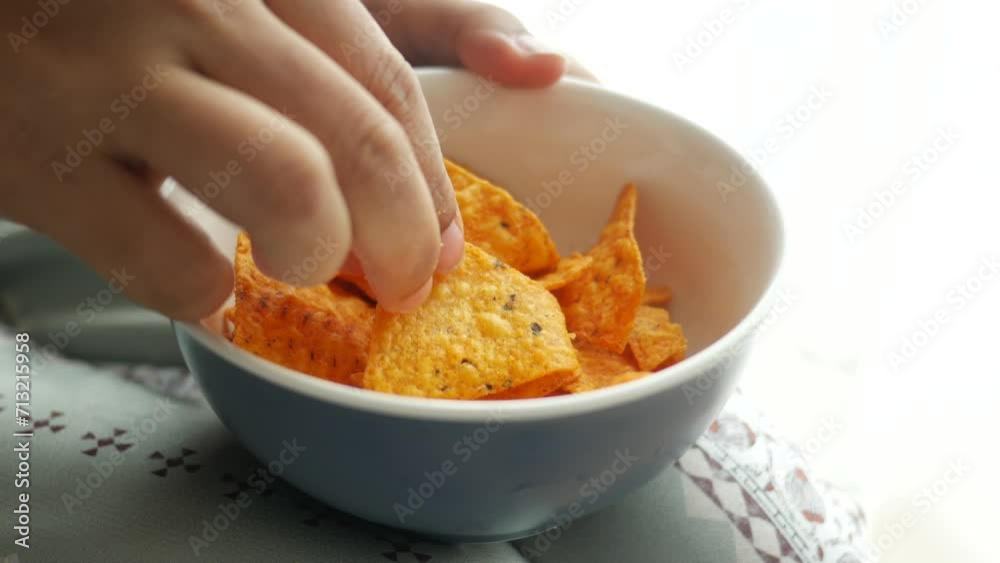 holding eating potato chips closeup holding eating potato chips closeup