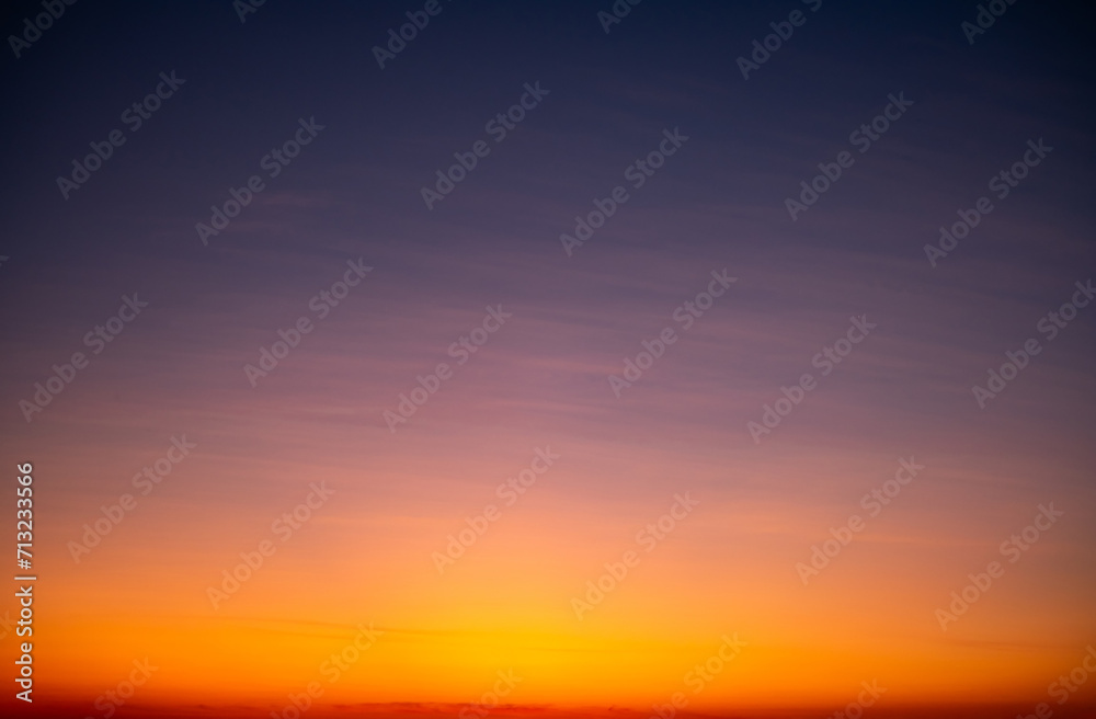 Fototapeta premium Beautiful , luxury soft gradient orange gold clouds and sunlight on the blue sky perfect for the background, take in everning,Twilight, Large size, high definition landscape photo