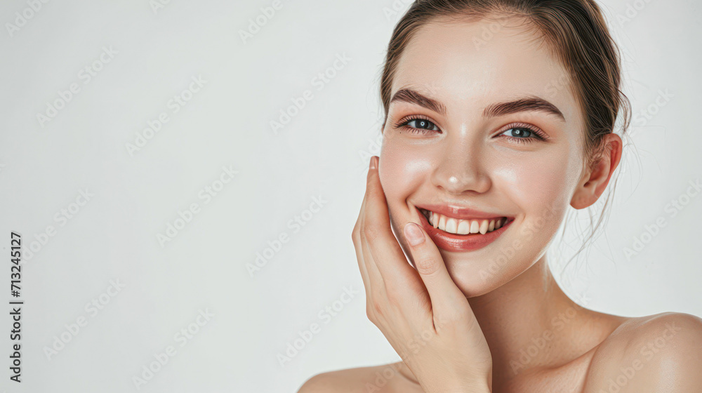 Portrait of beautiful woman with natural make up touching her face. Beauty young woman with fresh clean perfect skin. Skin care concept. Cosmetology, beauty and spa. Facial treatment. Natural skin. Portrait of beautiful woman with natural make up touching her face. Beauty young woman with fresh clean perfect skin. Skin care concept. Cosmetology, beauty and spa. Facial treatment. Natural skin.