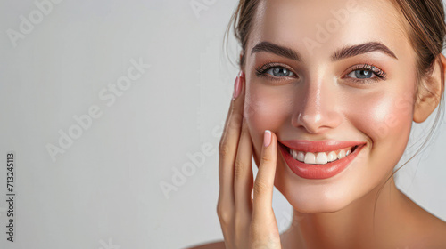 Portrait of beautiful woman with natural make up touching her face. Beauty young woman with fresh clean perfect skin. Skin care concept. Cosmetology  beauty and spa. Facial treatment. Natural skin.