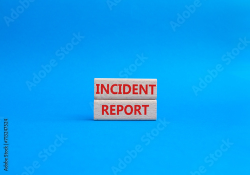 Incident Report symbol. Concept word Incident Report on wooden blocks. Beautiful blue background. Business and Incident Report concept. Copy space