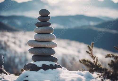 Stone tower in winter mountains Winter yoga theme