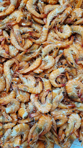 Chilled boiled shrimp in a supermarket or grocery store, close-up. Seafood