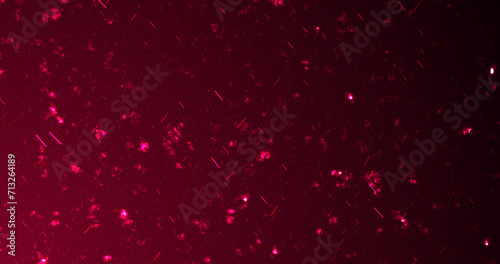 Ember particles hot fire dust burning flying up on black background. Hell backdrop glittering cosmic dust motion flames fiery flaming defocused ember sparkles blazing in sky. Cosmic explosion.