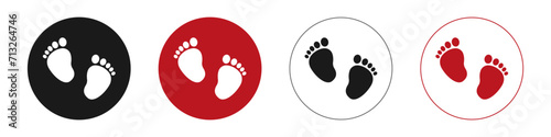 Set of vector illustrations of baby steps - pairs of black, pink and blue footprints in a flat styl