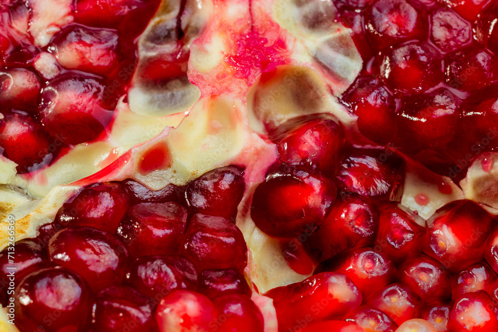 Close-up of a sliced pomegranate. Close-up of a sliced pomegranate.