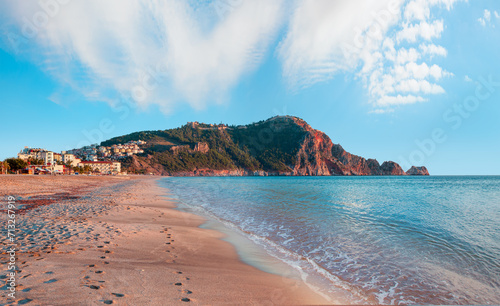 Fototapeta Naklejka Na Ścianę i Meble -  Cleopatra beach on sea coast with green rocks in Alanya peninsula, Antalya district, Turkey.
