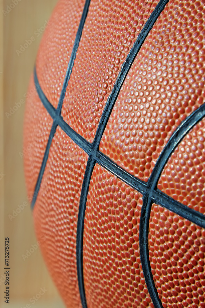 A close-up vertical frame of a basketball ball
