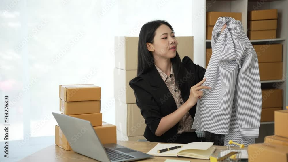 Starting a small business. Asian woman SME owner checks online orders. Selling products that work with boxes, freelancing at home, online sme business, small medium enterprises, 4k video Starting a small business. Asian woman SME owner checks online orders. Selling products that work with boxes, freelancing at home, online sme business, small medium enterprises, 4k video