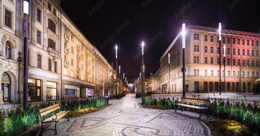 View of the city center at night. Historic European architecture, modern illumination.