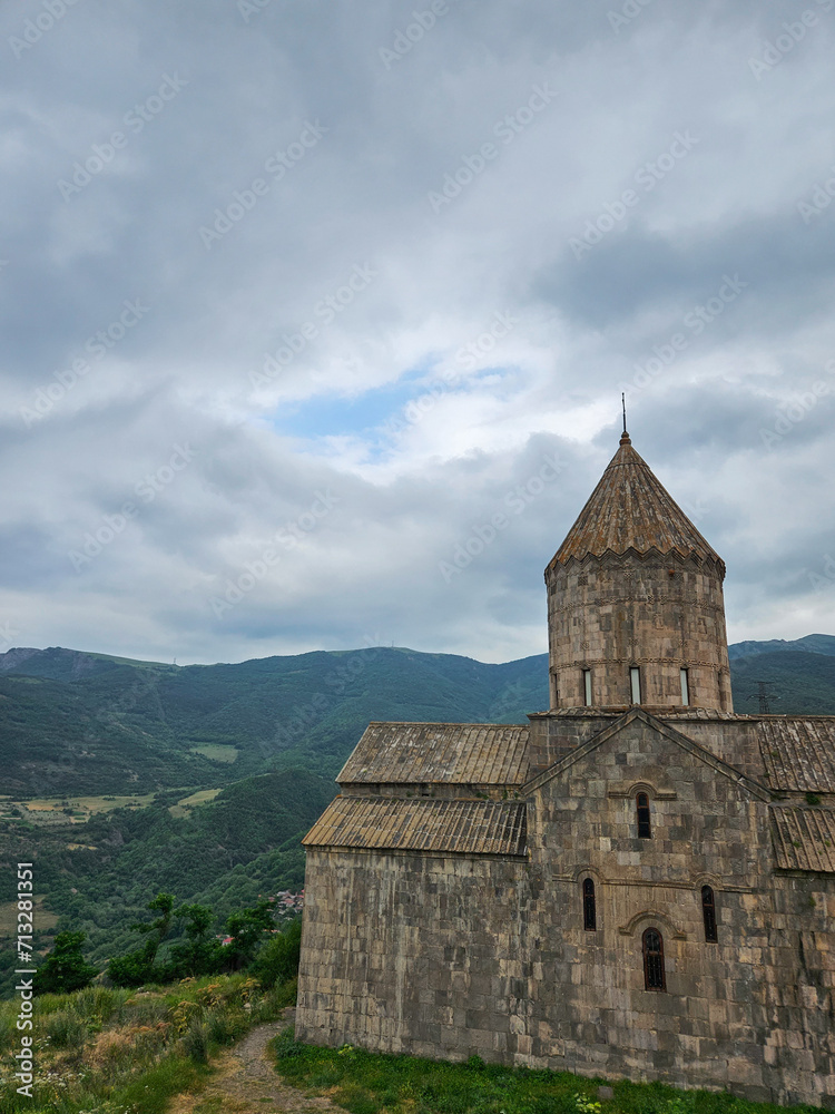 Scenic view of Tatev Monastery embraced by picturesque mountains Scenic view of Tatev Monastery embraced by picturesque mountains